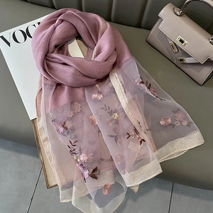 Detail of pink silk blend scarf with floral embroidery, organza panels and gold trim