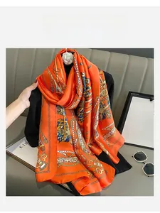 Detail of orange faux silk scarf featuring vintage nautical gold chain and rope patterns