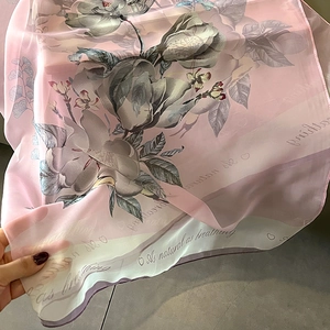 Elegant pink floral scarf with magnolia print and soft silk texture for women