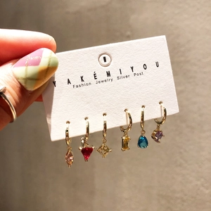 Detail of 6-piece earring set with multi-colored gemstones and gold finish silver posts