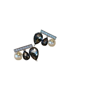 Chic black waterdrop gemstone and pearl seesaw earrings with zircon accents on white background