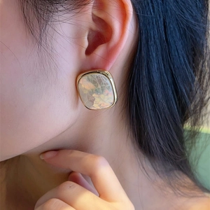 Elegant 925 silver square mosaic shell earrings with gold plating shown on a model