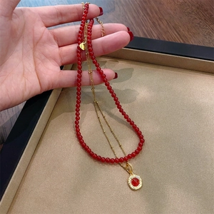 Vintage double-layer necklace with tiger eye stone and golden disc pendant design