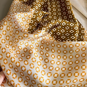 Elegant geometric patterned silk scarf with retro brown and orange floral patchwork print