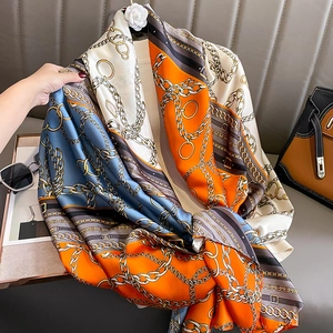 Elegant chain print silk scarf in orange and navy blue, stylish warm shawl for women