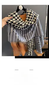 Detail of houndstooth and letter pattern scarf paired with a vibrant orange sweater