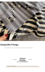 Detail view of houndstooth scarf with D letter pattern, fringe, and 65x190cm dimensions