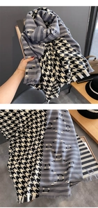 Detail of houndstooth scarf showing the thick cashmere-like texture and letter D pattern