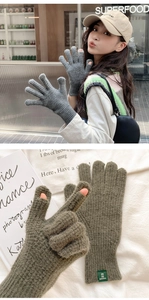 Detail of grey knitted gloves showing split-finger design and ribbed cuffs for warmth