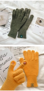 Detail of waffle knit gloves in green and yellow with finger openings for touchscreens
