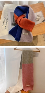 Detail eines farblich abgesetzten Strickschals mit dicker Textur und Fransen