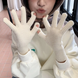 Knitted off-white gloves with finger openings and elastic cuffs for winter warmth