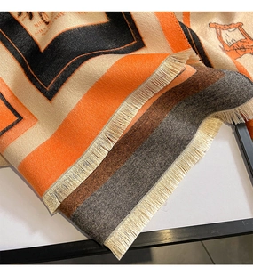 Close-up of vintage carriage jacquard pattern and soft fringe on the cashmere shawl