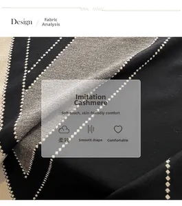 Detail of soft imitation cashmere scarf with geometric black and white diamond pattern