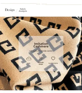 Detail showing soft imitation cashmere fabric with geometric patterns and smooth texture