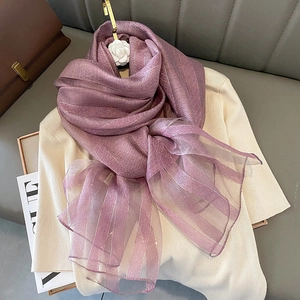 Detailed texture of lavender silk shawl with silver metallic stripes and jacquard floral