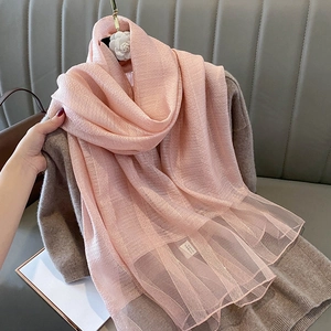 Detailed texture of pink silk wool scarf featuring 40% silk and 60% wool blend fabric