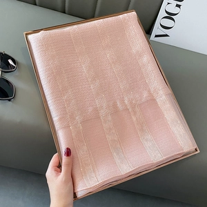 Pink silk blend scarf with metallic stripes in a gold tray for a stylish look