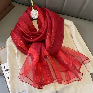 Detail of dark red silk blend scarf featuring subtle leopard print and gold thread stripes