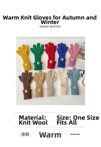 Detailed flat lay of ten colorful touchscreen knitted winter gloves in various pastel tones