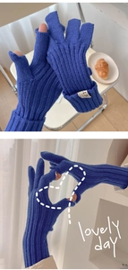 Detail of navy knit fingerless gloves with thumb and index finger touch screen openings