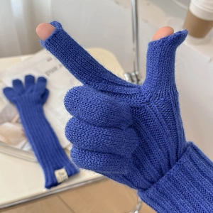 Close-up of navy blue knit gloves with finger openings for touchscreen use and ribbed cuff