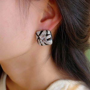 Vintage square stud earring with zebra pattern and centered rectangle zircon on a model
