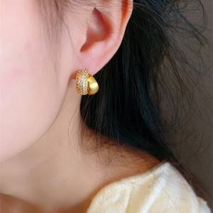 French style gold stud earrings featuring micro-paved zircons and a matte arc finish