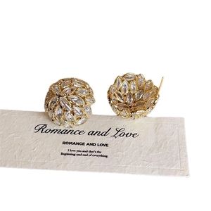 Elegant gold flower cluster stud earrings with sparkling marquise-cut crystals on a card