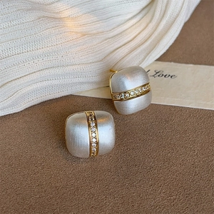 Luxurious geometric square stud earrings with brushed silver finish and gold crystal band