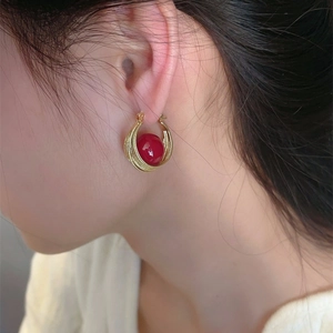Elegant festive red pearl hoop earrings with a gold-tone twisted metal design for women