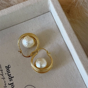 Elegant festive red pearl hoop earrings with gold twisted texture and vintage style