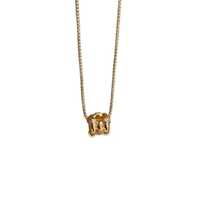 Luxurious gold cylinder pendant necklace with zircon multi-ring detail on box chain
