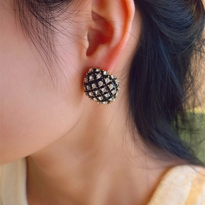 Vintage style gold-plated square geometric stud earrings with black rhinestones on model