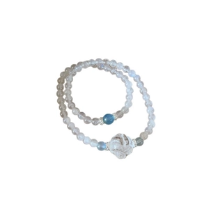 Double-layered moonstone beaded bracelet set with blue accents and carved crystal charm