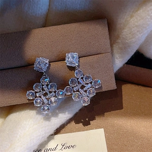 Sparkling geometric snowflake drop earrings with pave zircons in a silver-tone finish