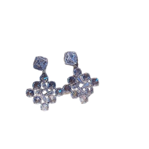 Elegant silver snowflake earrings with sparkling zircon crystals in a geometric cluster design
