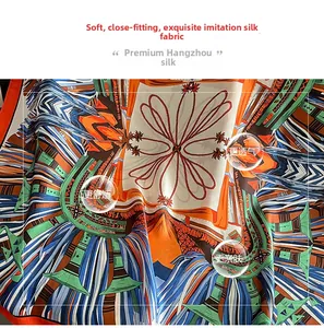 Macro detail of breathable silk scarf showing vibrant geometric patterns and soft texture