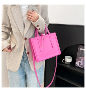 Modern bright pink square crossbody bag styled with a beige blazer for a chic casual look