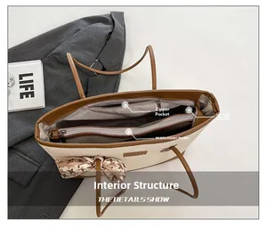 Top view of large tote bag interior showing main compartment and zipper pockets