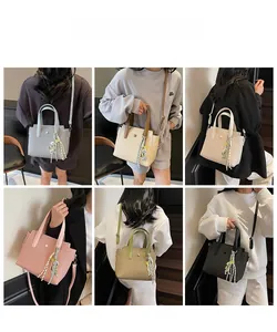 Detail view of woven texture tote bags in six colors with bear charms and straps