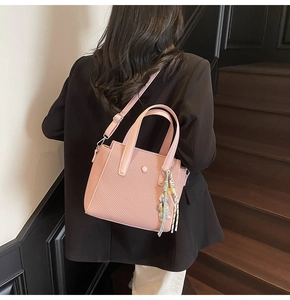 Pink woven texture tote bag with elegant silk scarf detail and adjustable strap for women
