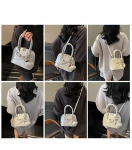 Collage of model showcasing shell crossbody bag in silver and beige with heart charm