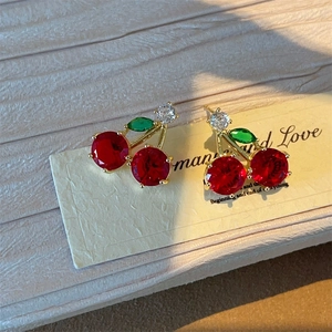 Exquisite red cherry stud earrings with emerald green leaves and gold metal settings