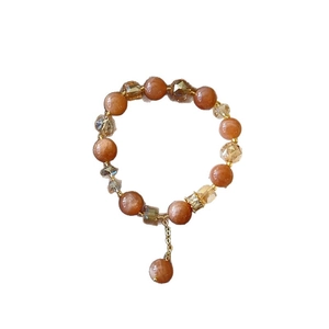 Bracciale fatto a mano con pietre di sole, cristalli sfaccettati e dettagli dorati