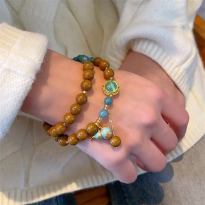 Ethnic wood bead bracelet set with blue jade beads and cloisonne gourd charm for women