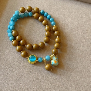 Ethnic double-layer beaded bracelet with blue calabash charm and blue stone beads