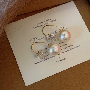 Elegant gold hoop earrings with white faux pearl and zircon crystal tassels