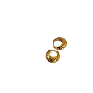 Chic faceted gold hoop earrings for women featuring unique light-reflecting geometric textures
