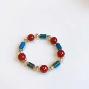 Vintage style bracelet with red agate, blue beads and faceted champagne crystals